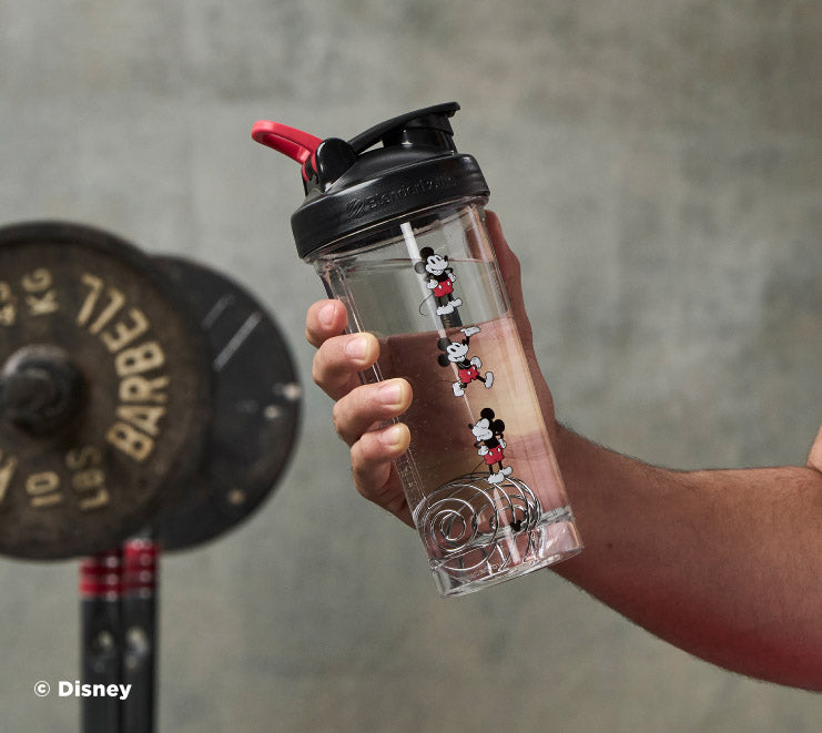 pro-series-m7 Mickey_Mouse_Protein_Shaker_Bottle_Being_Held_In_the_Gym.jpg